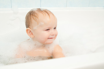 Wall Mural - cute adorable baby play with foam in bath