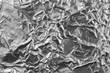 Natural Crumpled Silver Aluminum Foil Closeup Background Textur