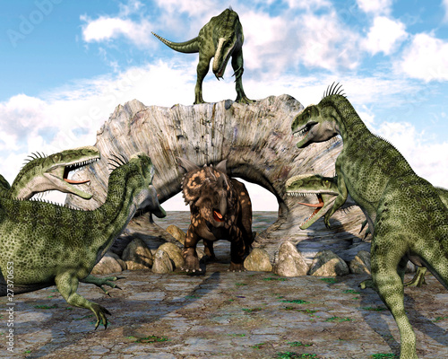 Obraz w ramie monolophosaurus gang ready to attack einiosaurus