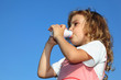 © Pavel Losevsky - little girl drinks yoghurt from a small small bottle of yoghurt