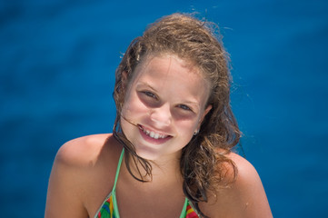 The happy girl against the sea