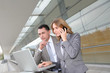 © goodluz - Sales people working outside modern building