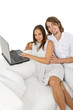 © djma - Young european couple surfing the web at home