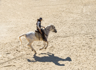Fototapete - Sheriff riding his horse at a gallop