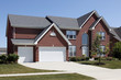 © pics721 - Red brick home with three car garage