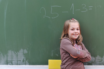 happy school girl on math classes