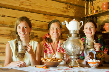 women having tea in russian  interior