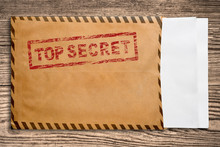 Envelope With Top Secret Stamp And Blank Papers.