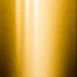 Brushed gold metal plate with reflections