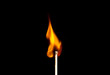 © Tibet - burning match on black background