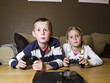 © gemenacom - Siblings playing video games