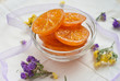 Caramelized orange slices in a glass bowl