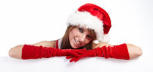 Beautiful Christmas Woman In Santa Hat Holding Empty Board
