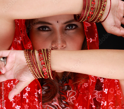 Naklejka ścienna Beautiful Eastern girl with black veil on face