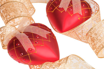 Christmas red ball in a form of heart with ribbon