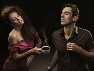 Sexy couple with cup of coffee