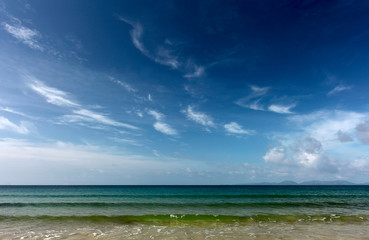 Wall Mural - The sea with clear water yellow fine sand and sky with fluffy clouds