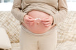 © WavebreakMediaMicro - Close up of a pregnant woman breaking a cigarette