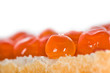 Close-up on a piece of bread with red caviar (fish roe)