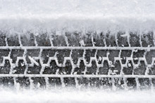 Close-up tire tracks in snow