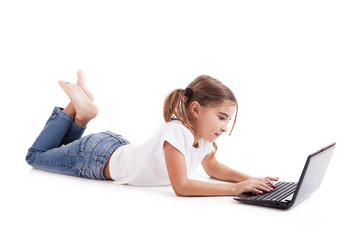 Wall Mural - Little student girl with a laptop