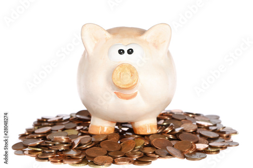 sparschwein auf einem haufen münzgeld Fotobehang