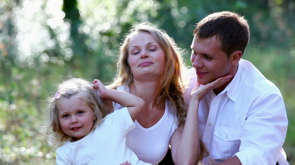 Sticker - Young family enjoying leisure time together in the park