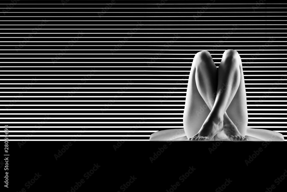 black and white artistic nude, with crossed legs, shot on stripe - obrazy, fototapety, plakaty 