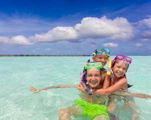 Happy children playing in sea