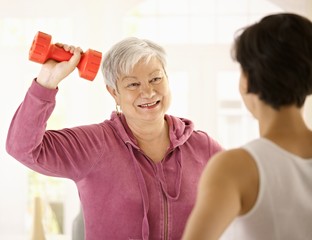 Sticker - Senior woman doing dumbbell exercise