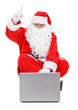 © kmit - Surprised Santa claus and laptop on white