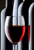 Fototapeta  - glass of red wine with bottle