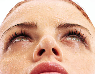 Close-up portrait of a beautiful female on white background.