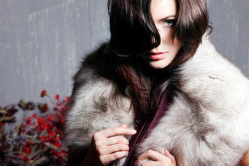 young beautiful girl in a fur collar