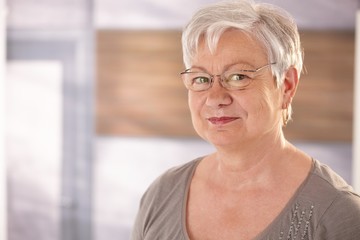 Canvas Print - Portrait of senior woman with glasses