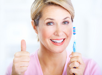 Wall Mural - Woman with a  toothbrush