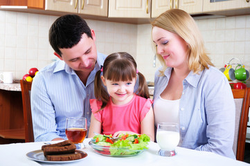 Dad, Mom and their little daughter