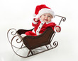 © blessings - Smilng santa baby sitting in a sleigh