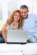 © goodluz - Couple surfing on internet at home