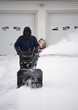 © Image Source - Man Operating A Snow Blower