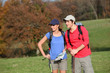 © goodluz - Young couple hiking in countryside