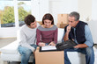 © goodluz - Young couple signing contract for home moving