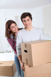 © goodluz - Young couple moving in new house