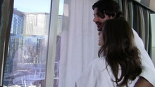 Vacationing Couple Looks Out Window - HD
