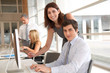 © goodluz - Co-workers in business training