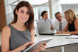 © goodluz - Executive woman working on electronic tab