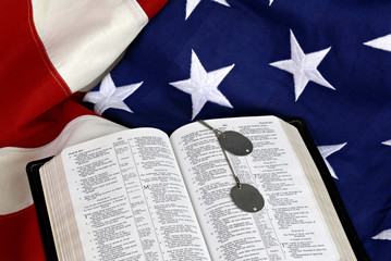 Open Bible with Dog Tags on American Flag