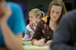 © lightpoet - pretty female college student sitting in a classroom