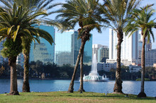 Orlando, Florida. Lake Eola And Palm Trees In Foreground.