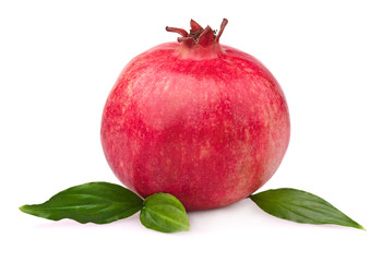 Juicy pomegranate with leaves. Isolated on a white background